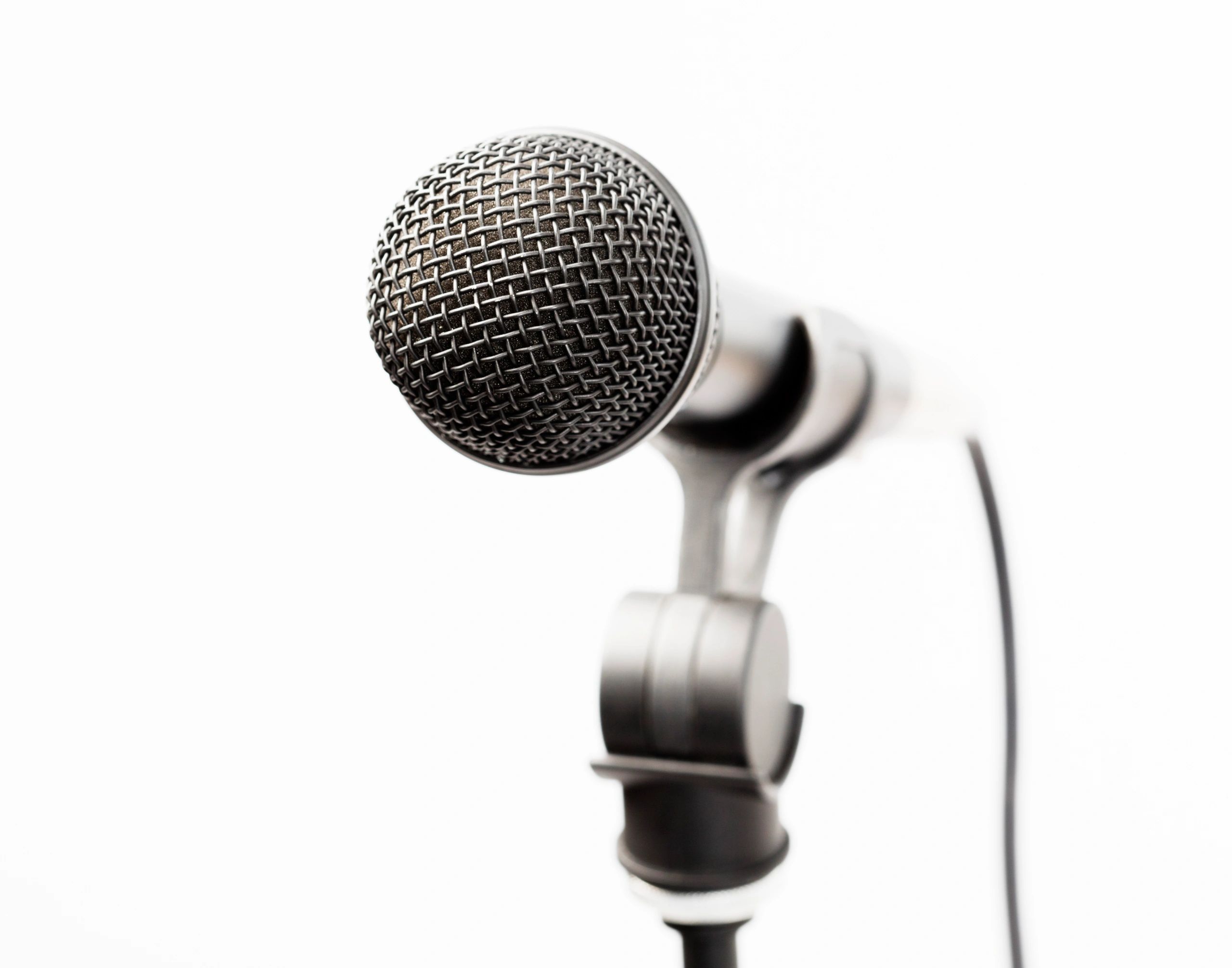 Microphone on stand representing public speaking